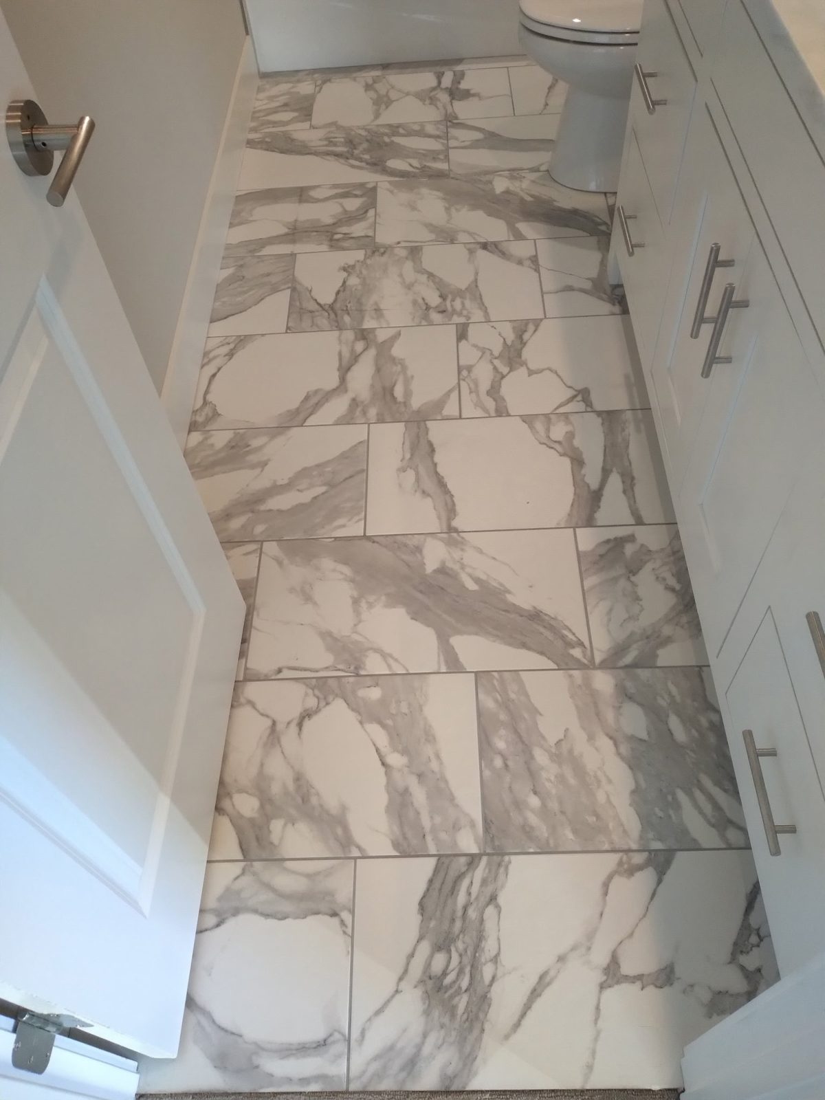 Marble-look tile floor installation